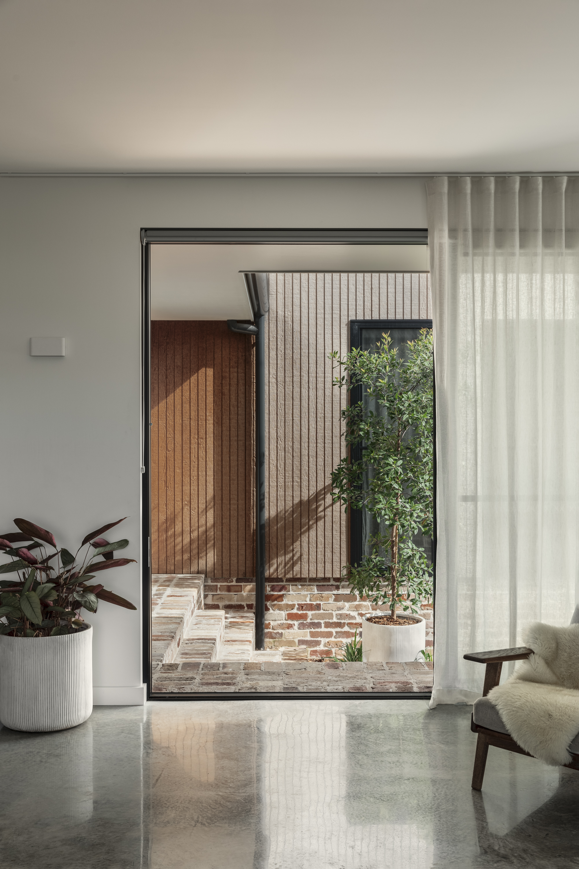 Courtyard detail — recycled brick and timber cladding